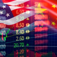 Symbolic image of the U.S.-China trade war in 2025, featuring national flags, a cracked globe, stock market graphs, and economic conflict symbols.